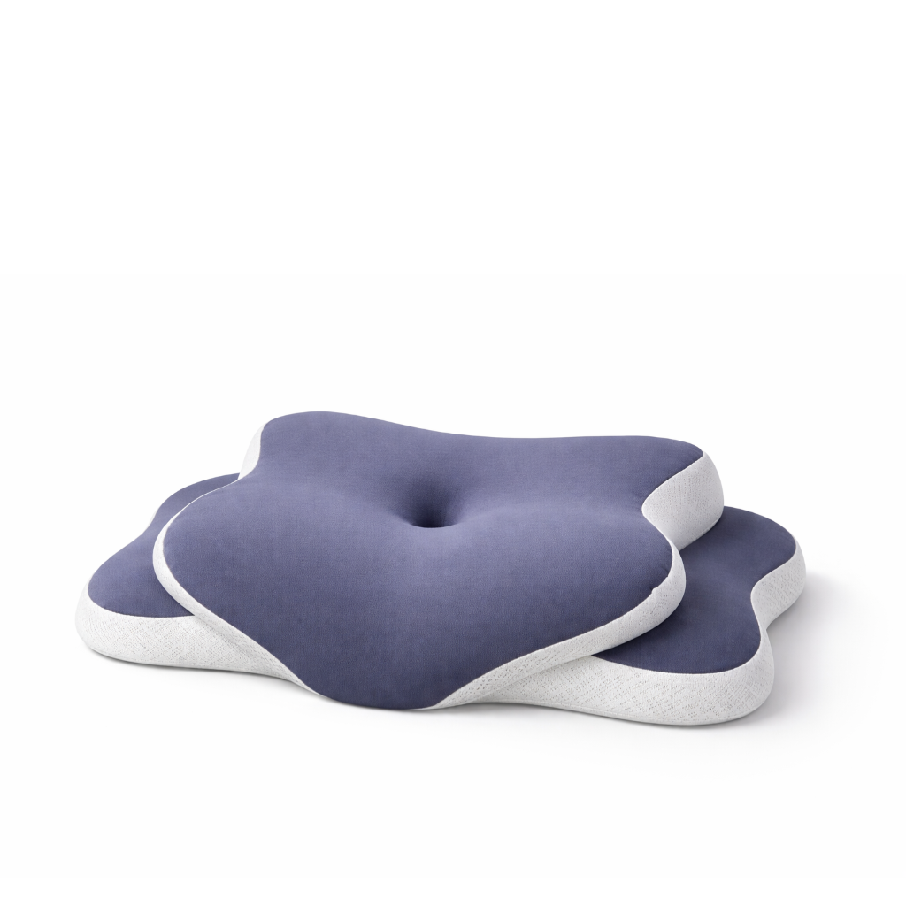 Oreiller ergonomique violet avec forme incurvée pour le soutien de la nuque.